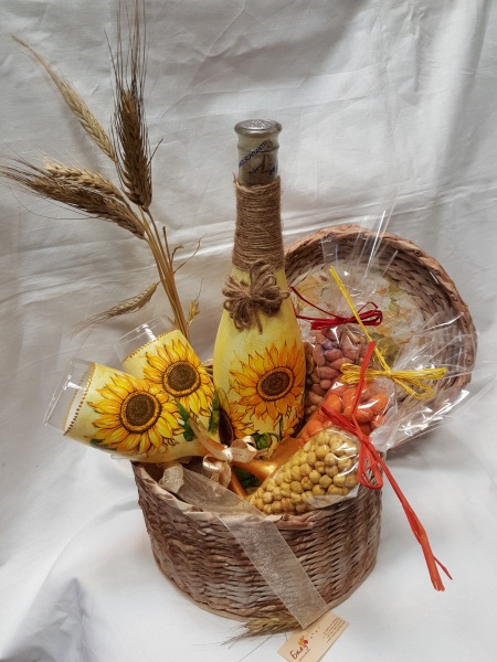 Hand-woven basket with wine and sunflowers