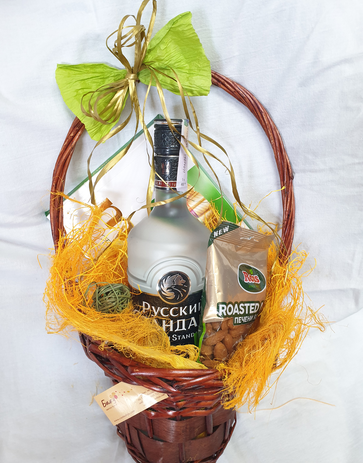 Basket with vodka Russian Standard, Mersi and almonds